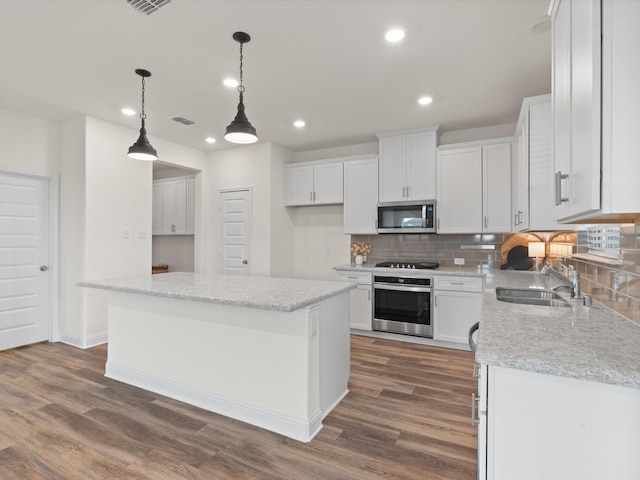 3601 Keechi Creek Dr, Celina, TX 75078 - kitchen with backsplash, recessed lighting, appliances with stainless steel finishes, and a sink