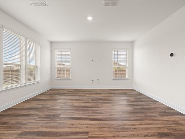 3601 Keechi Creek Dr, Celina, TX 75078 - empty room featuring baseboards, recessed lighting, dark wood finished floors, and visible vents