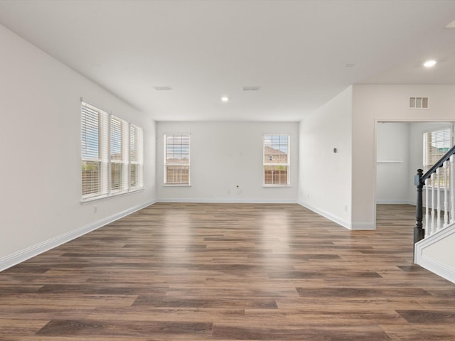 3601 Keechi Creek Dr, Celina, TX 75078 - empty room with stairs, visible vents, dark wood finished floors, recessed lighting, and baseboards