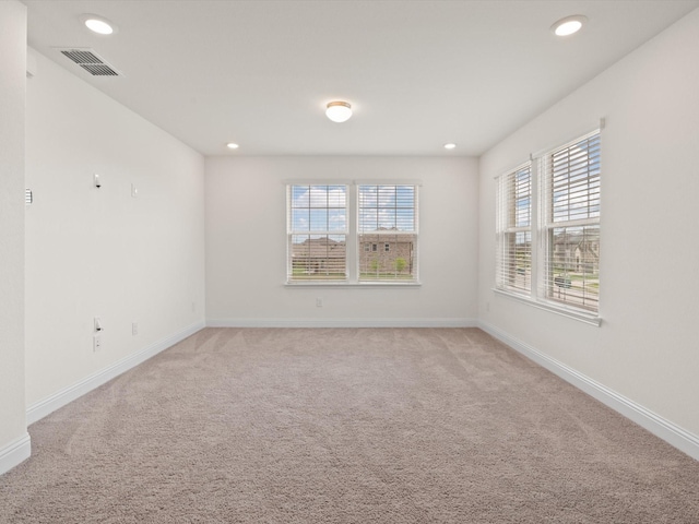 3601 Keechi Creek Dr, Celina, TX 75078 - empty room featuring light colored carpet, baseboards, visible vents, and recessed lighting