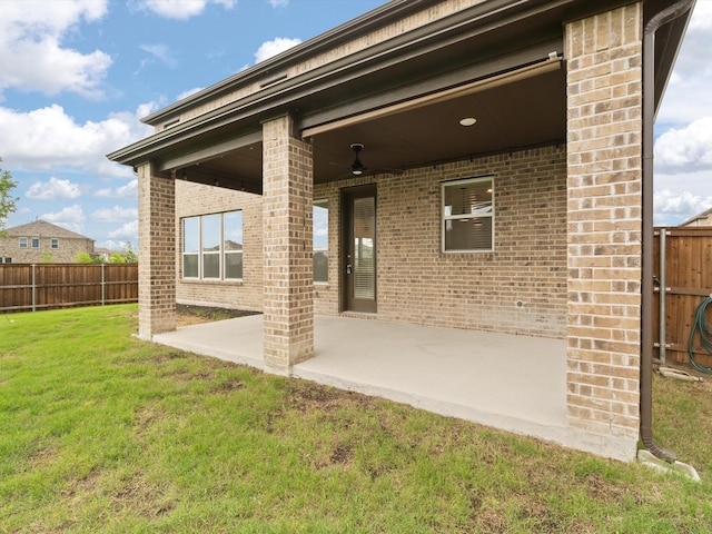 3601 Keechi Creek Dr, Celina, TX 75078 - rear view of property featuring a yard, a patio, brick siding, and fence