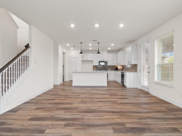 3601 Keechi Creek Dr, Celina, TX 75078 - unfurnished living room featuring dark wood finished floors, baseboards, stairs, and recessed lighting