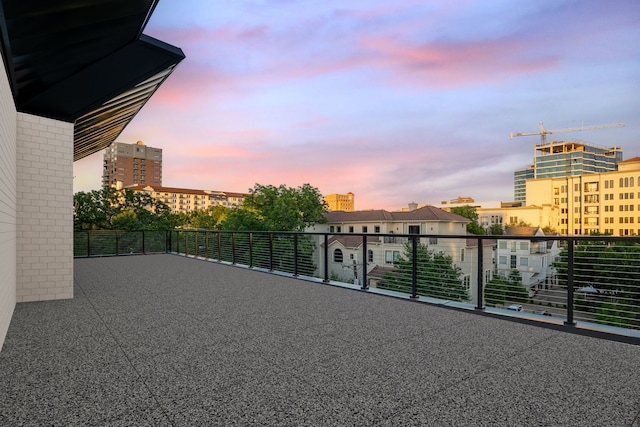 3601 Routh St Ph 4A, Dallas, TX 75219 - patio terrace at dusk featuring a balcony