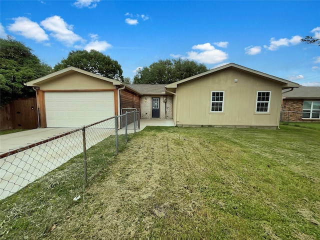 single story home with an attached garage, fence, driveway, and a front yard
