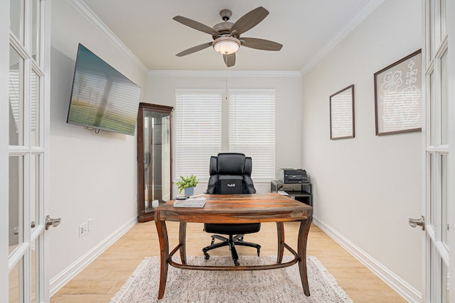 office with crown molding, a ceiling fan, baseboards, and light wood-type flooring