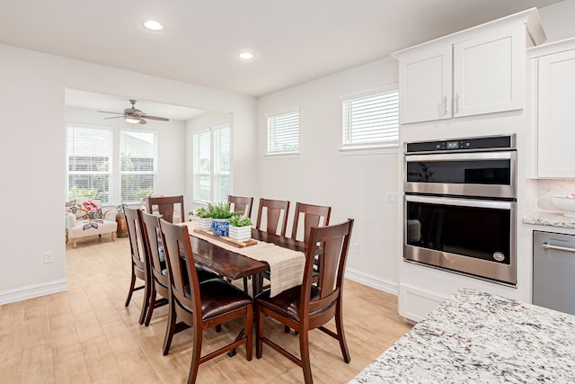 dining room with a ceiling fan, baseboards, recessed lighting, and light wood-style floors