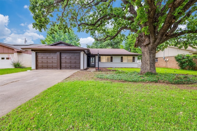 ranch-style house with brick siding, an attached garage, driveway, and a front lawn