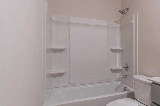 full bath with vanity, toilet, and shower / washtub combination