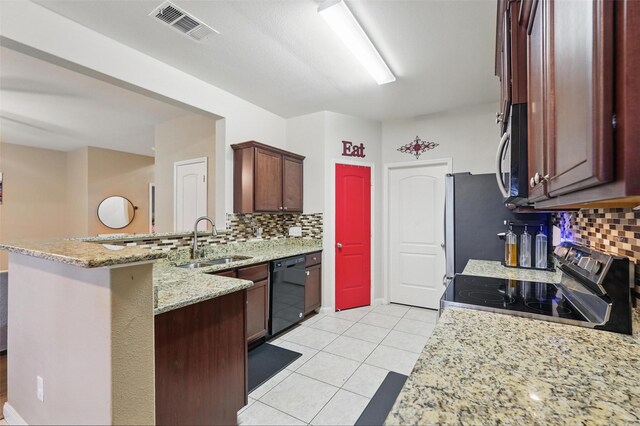 kitchen featuring a sink, black dishwasher, stainless steel range with electric cooktop, and decorative backsplash