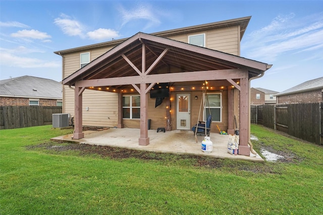 rear view of house featuring a patio area and central air condition unit