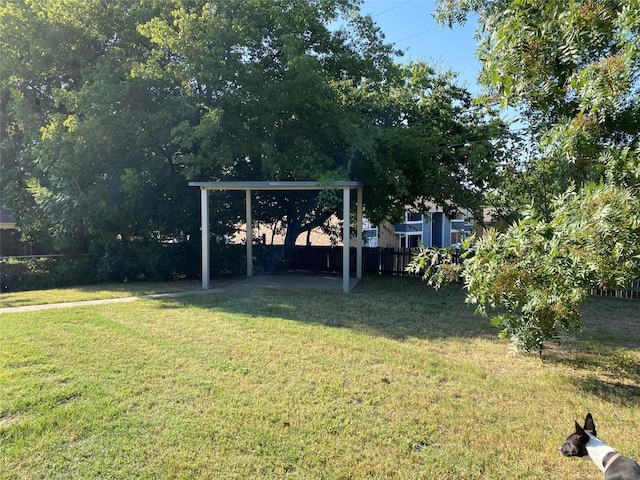 2406 Parkside Dr, Grand Prairie, TX 75052 - view of yard with a patio, fence, and a carport