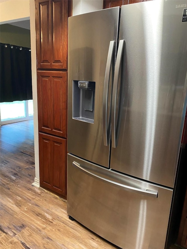 2406 Parkside Dr, Grand Prairie, TX 75052 - kitchen with stainless steel fridge and light wood-type flooring