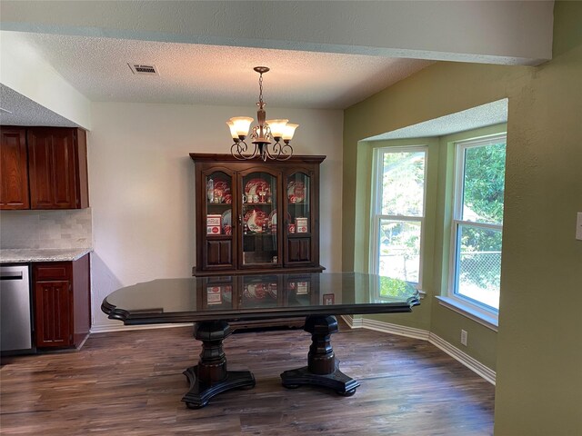 2406 Parkside Dr, Grand Prairie, TX 75052 - dining room featuring plenty of natural light, dark wood finished floors, a notable chandelier, and visible vents