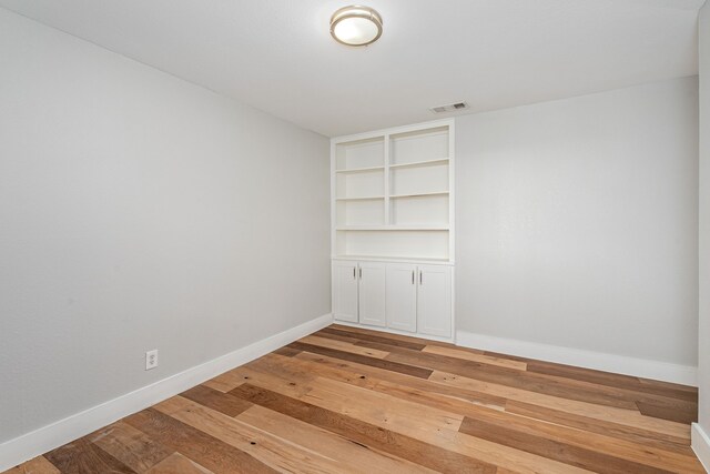 3005 Macao Ct, Plano, TX 75075 - empty room featuring visible vents, light wood finished floors, and baseboards