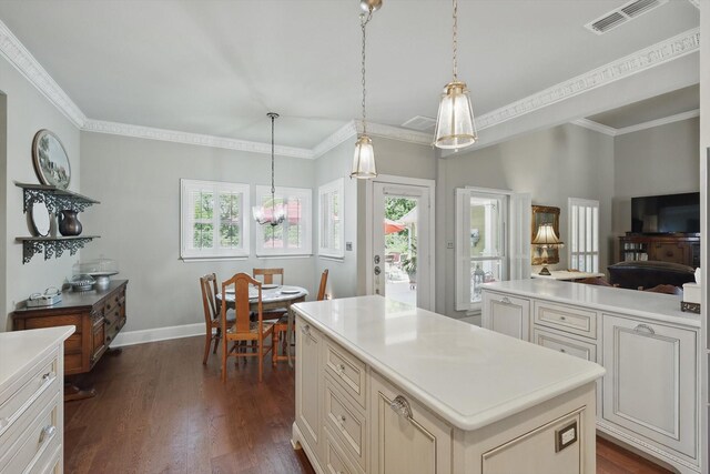 kitchen with light countertops, visible vents, a wealth of natural light, and dark wood finished floors