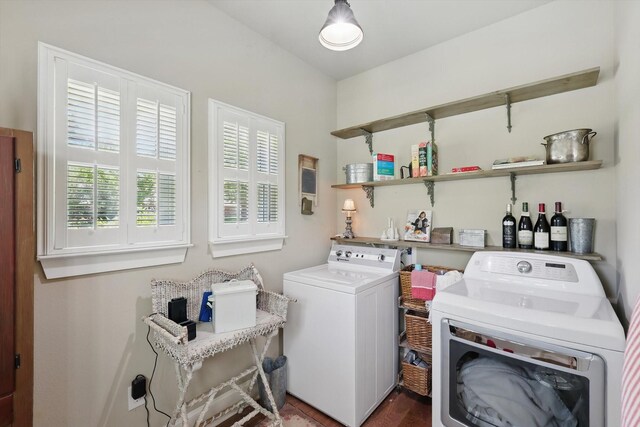 clothes washing area featuring laundry area and washing machine and clothes dryer