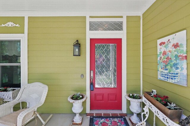 property entrance featuring covered porch