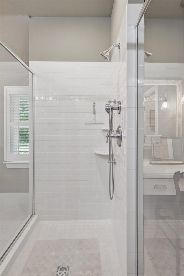 bathroom with a shower stall