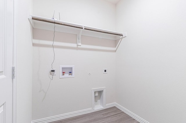 119 Kylie Dr, Cleburne, TX 76031 - clothes washing area with washer hookup, laundry area, hookup for a gas dryer, wood finished floors, and hookup for an electric dryer