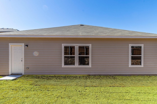119 Kylie Dr, Cleburne, TX 76031 - back of property with a lawn and a shingled roof