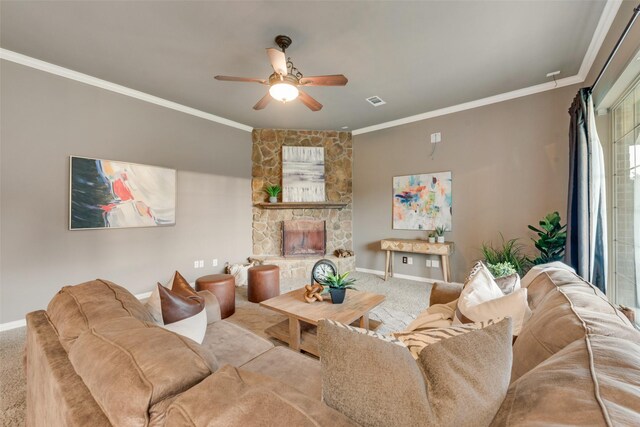 living room with crown molding, baseboards, carpet, and a ceiling fan