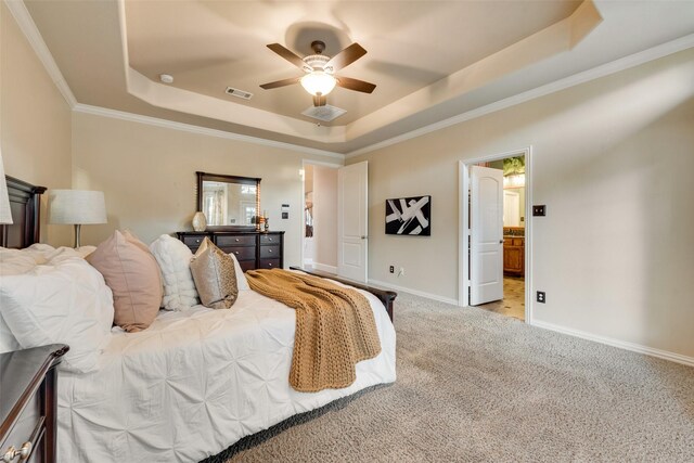 bedroom with visible vents, carpet flooring, a raised ceiling, and crown molding