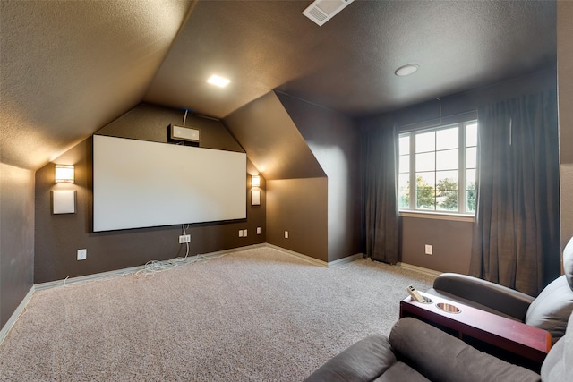 home theater with baseboards, carpet, and a textured ceiling