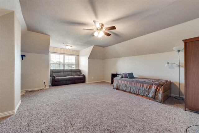 bedroom with baseboards, carpet flooring, ceiling fan, and vaulted ceiling