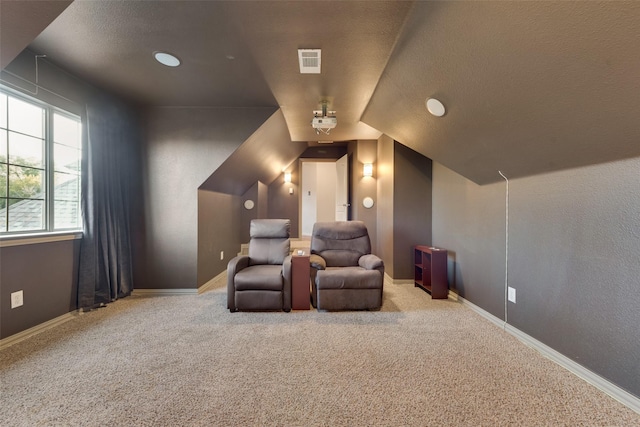 132 Silver Rose Blvd, Burleson, TX 76028 - carpeted home theater featuring a textured ceiling, lofted ceiling, and baseboards