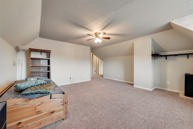 bedroom featuring ceiling fan, carpet, baseboards, lofted ceiling, and visible vents