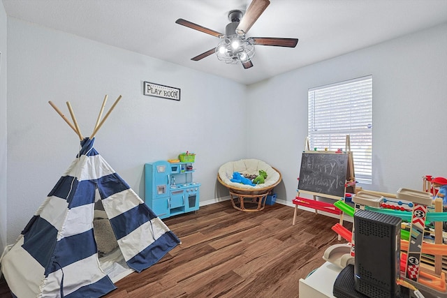 1225 Bellevue Dr, Princeton, TX 75407 - rec room with baseboards, a ceiling fan, and wood finished floors