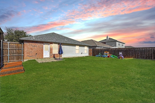 1225 Bellevue Dr, Princeton, TX 75407 - yard at dusk with a fenced backyard