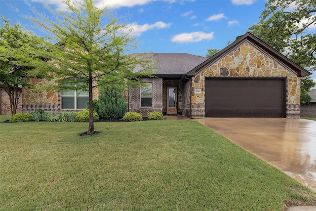view of front of property with driveway, brick siding, a front lawn, an attached garage, and stone siding