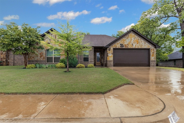 view of front of house featuring an attached garage, concrete driveway, a front yard, and stone siding