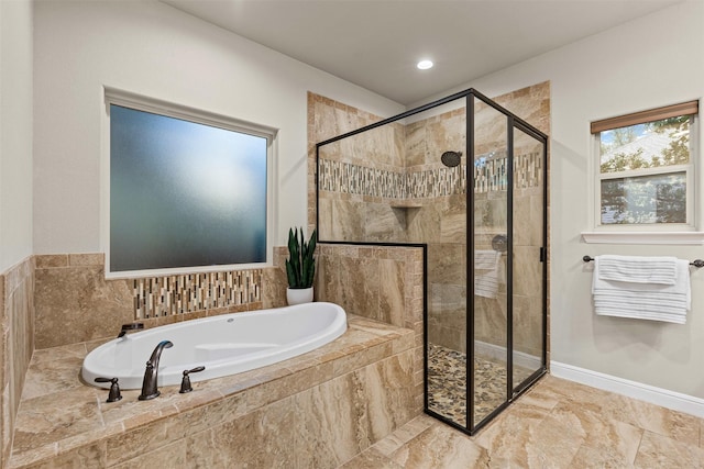 bathroom featuring a shower stall, recessed lighting, and a bath