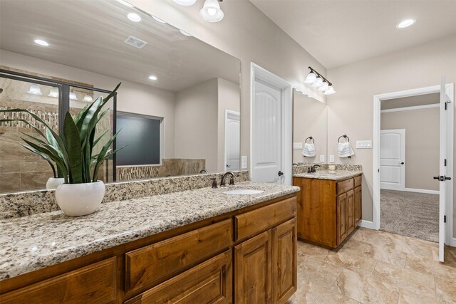 full bath with vanity, baseboards, recessed lighting, and visible vents