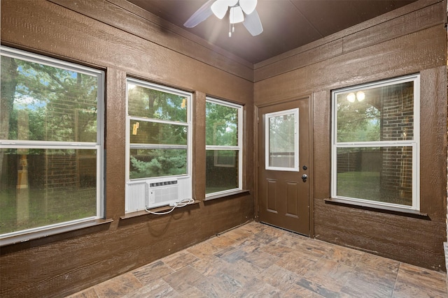 unfurnished sunroom with cooling unit
