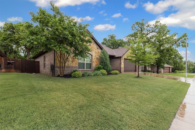 308 Donna Cir, Granbury, TX 76049 - view of front of property with an attached garage, stone siding, brick siding, and driveway