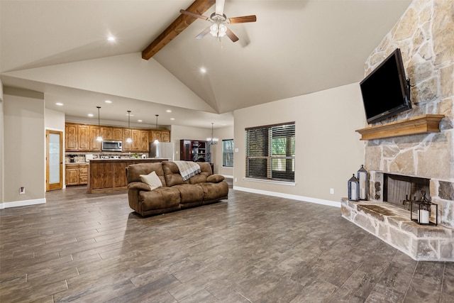 308 Donna Cir, Granbury, TX 76049 - living area with a fireplace, a ceiling fan, beam ceiling, dark wood-style flooring, and baseboards