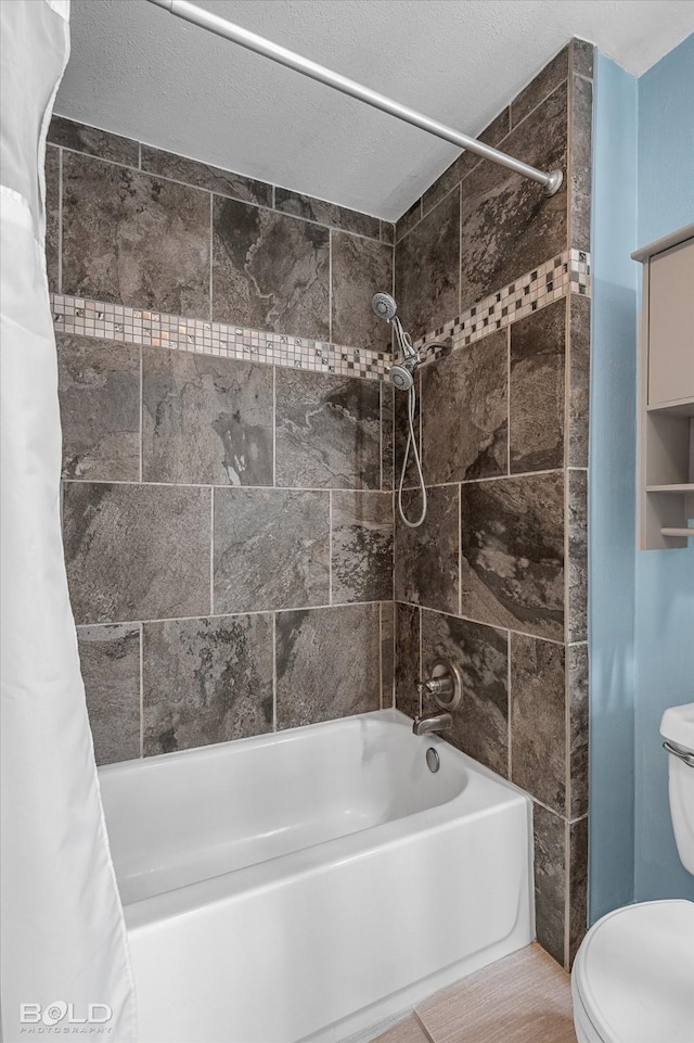 full bath with toilet and shower / tub combo