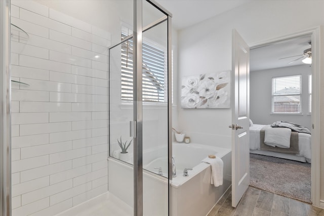 1008 Sublime Dr, Heath, TX 75126 - bathroom with connected bathroom, wood finished floors, a garden tub, and a stall shower
