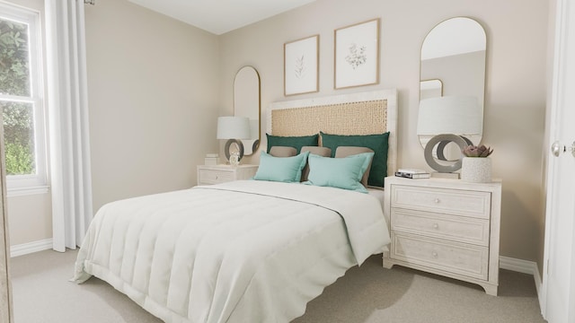 bedroom with carpet floors and baseboards