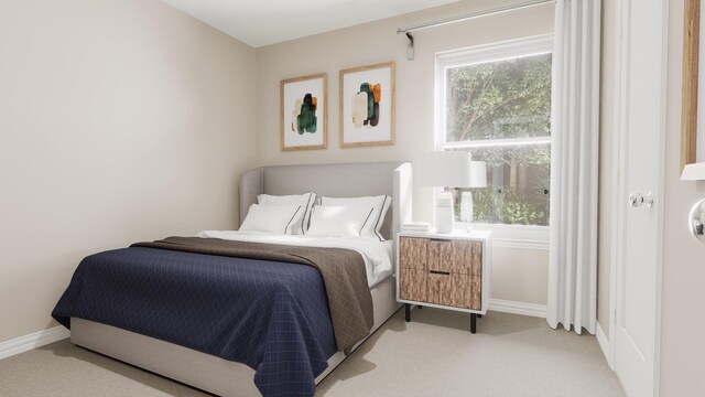 bedroom featuring light colored carpet and baseboards