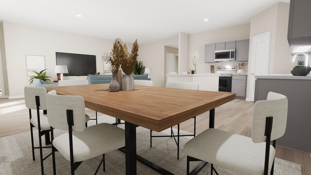 dining area with recessed lighting, baseboards, and light wood-style floors