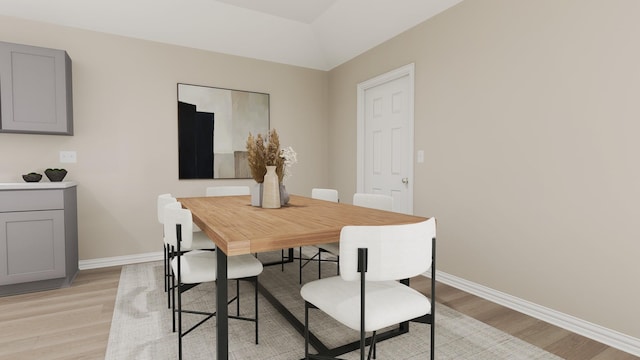 dining room with baseboards and light wood-style flooring