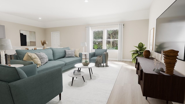 living room featuring recessed lighting, baseboards, and light wood-style flooring
