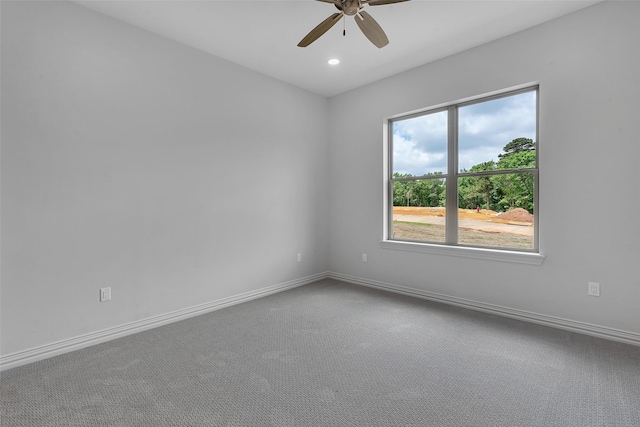 carpeted spare room with baseboards, a ceiling fan, and recessed lighting