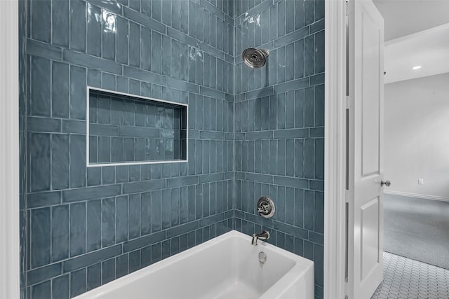 full bath with baseboards and bathtub / shower combination