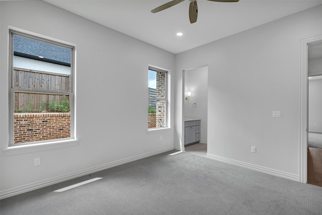 unfurnished bedroom with a ceiling fan, carpet floors, baseboards, connected bathroom, and recessed lighting