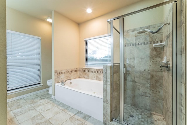 full bath featuring a tub with jets, a stall shower, and toilet